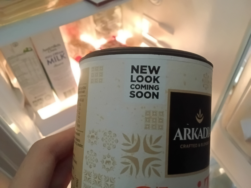 Cardboard can of chai tea with a message: "New look coming soon"